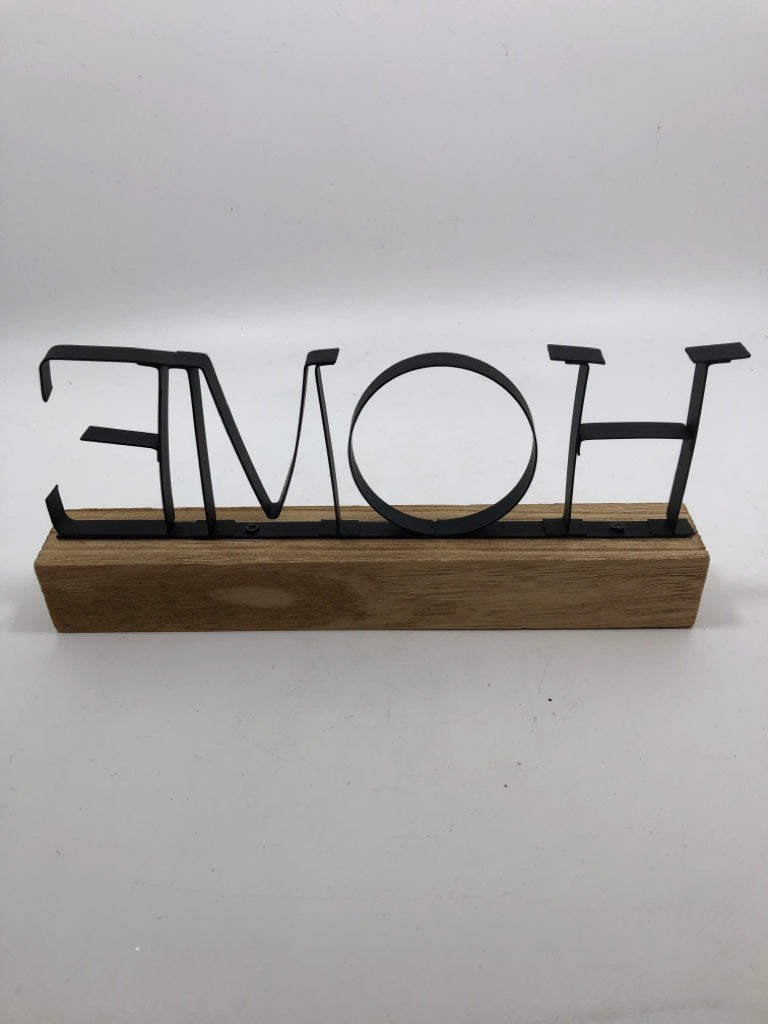 "HOME" METAL SIGN ON WOOD BLOCK.
