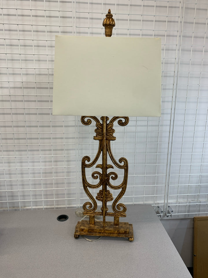 GOLD SCROLL METAL BASE LAMP W/SQUARE WHITE SHADE.