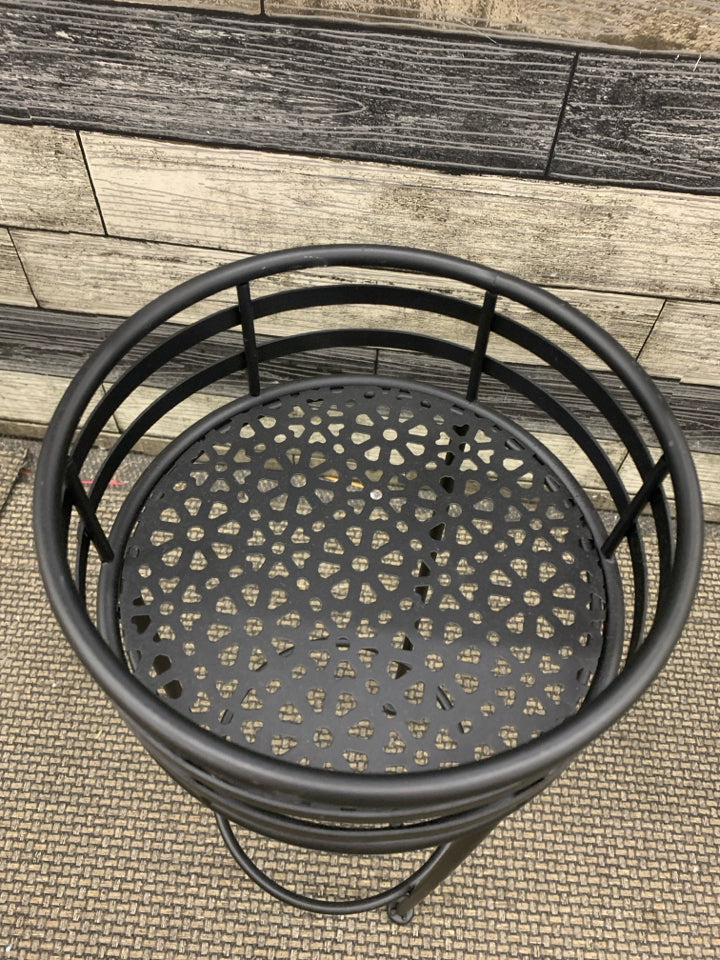BLACK METAL PLANT STAND FLOWER PIERCED BASE.