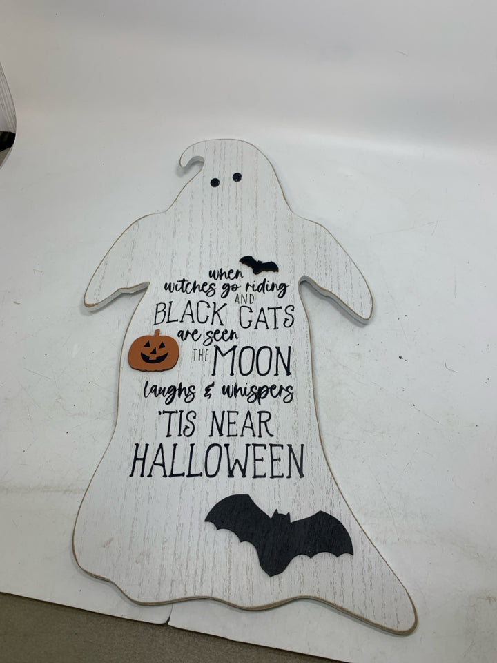 WHITE GHOST SHAPED  TIS NEAR HALLOWEEN SIGN.