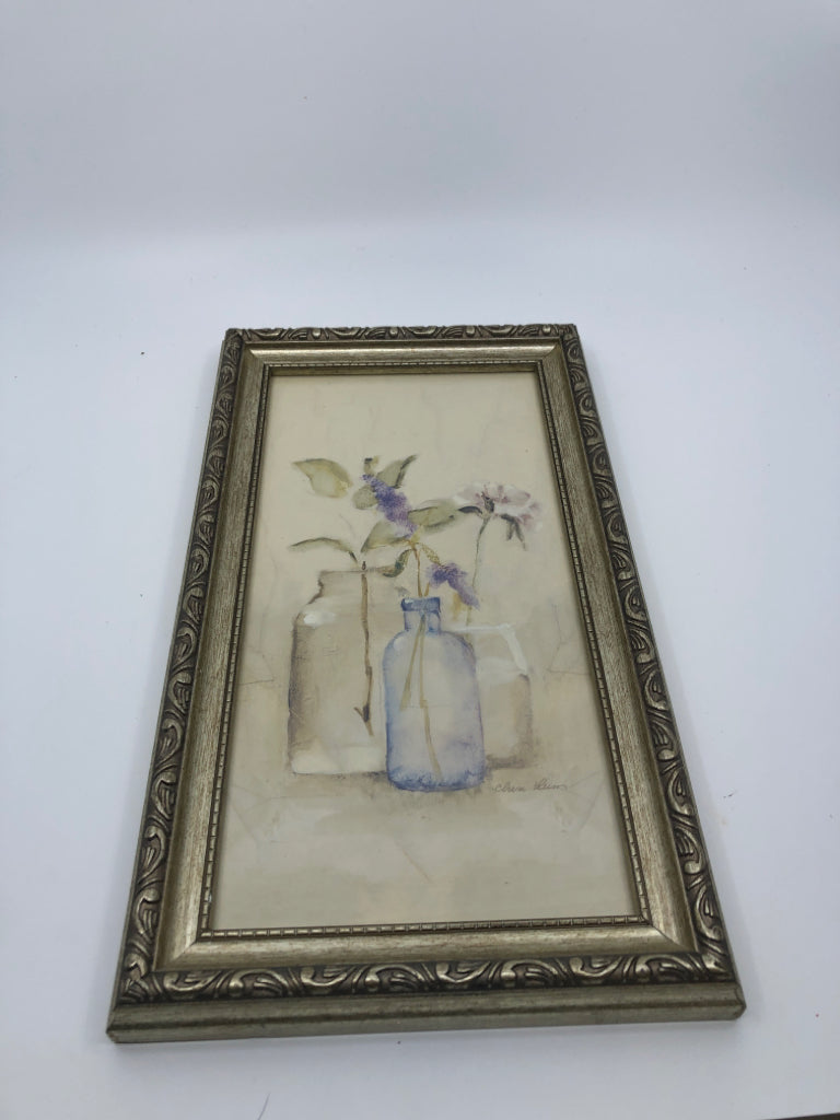 FLORAL IN BOTTLE VASE IN SILVER FRAME WALL HANGING.