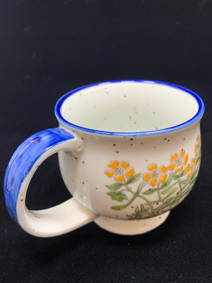 BLUE CERAMIC DOTTED MUG W/ORANGE FLOWERS.