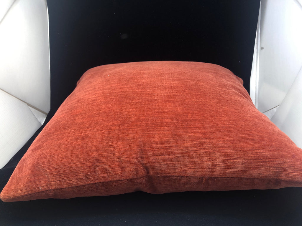 SMALL RED ORANGE ACCENT PILLOW.