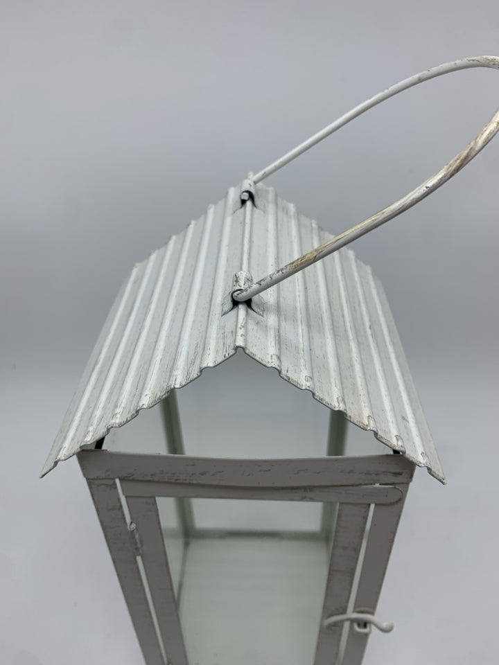 WHITE METAL CANDLE LANTERN.
