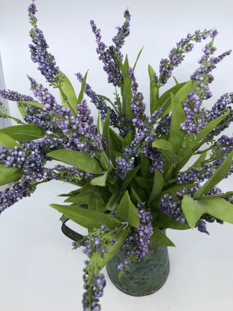 METAL PITCHER W/ FAUX PURPLE FLOWERS.