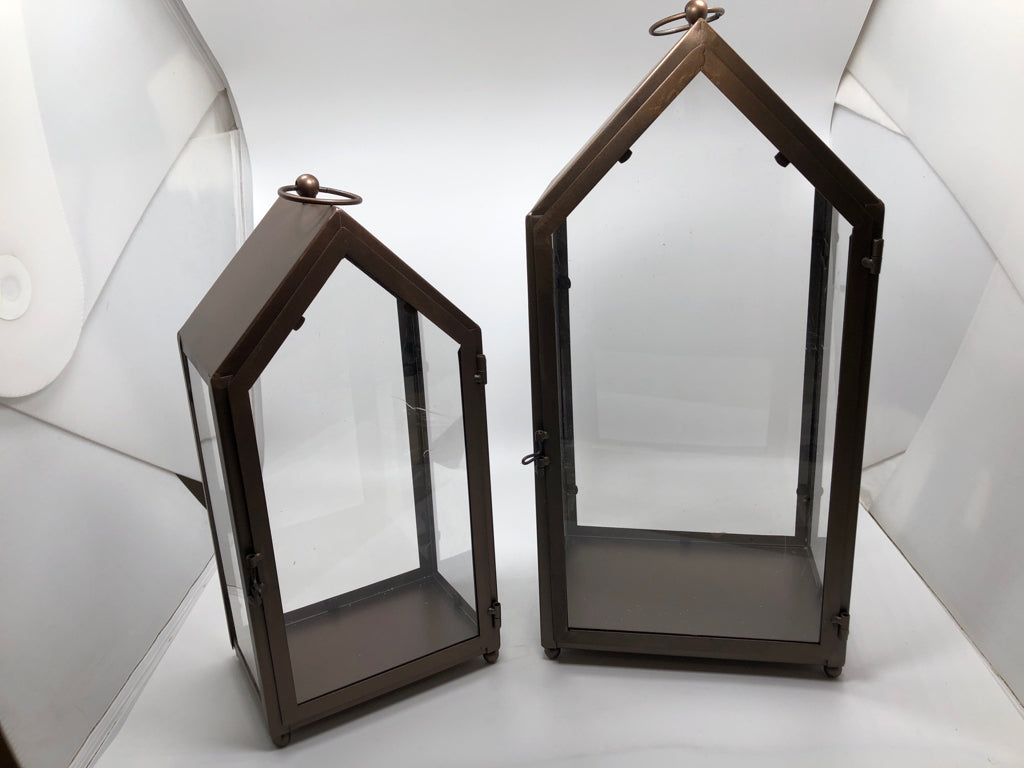 2 BROWN METAL CANDLE LANTERNS.