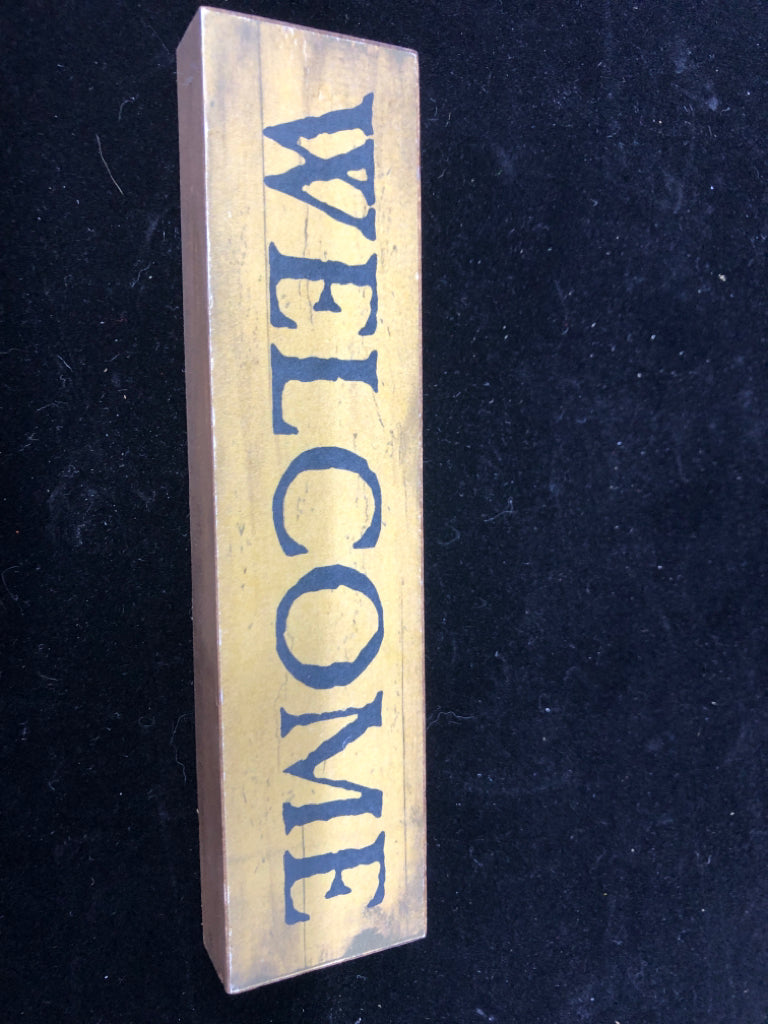 PRIMITIVE "WELCOME" BLOCK SIGN.