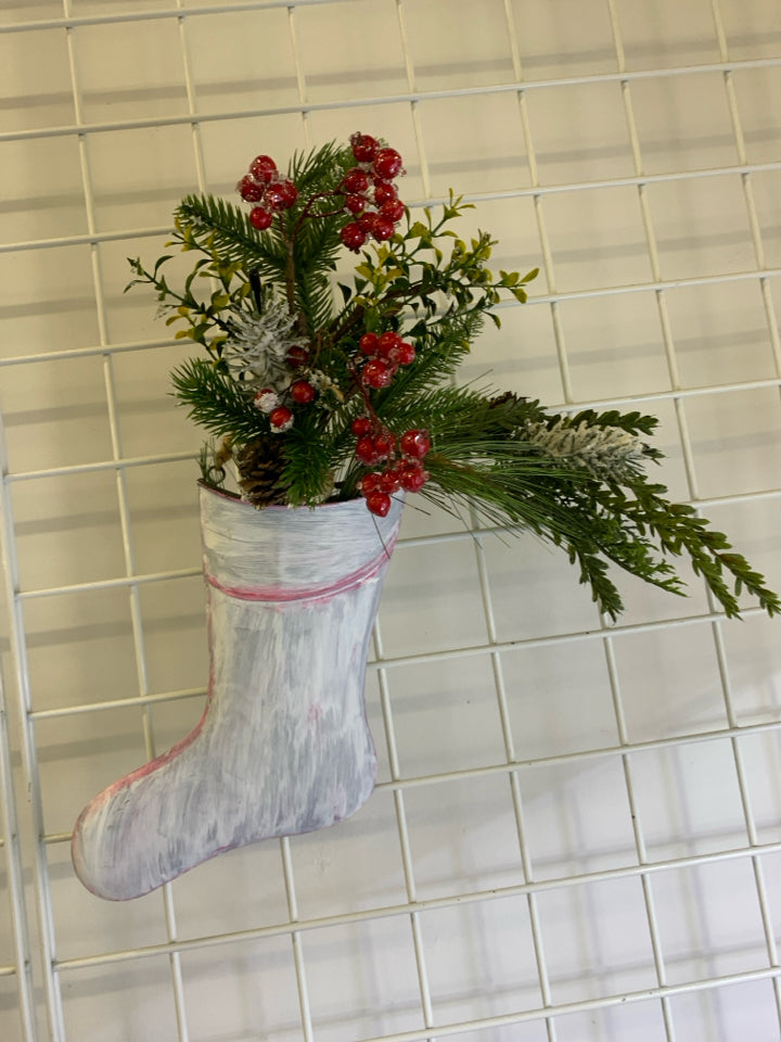 METAL STOCKING PAINTED WHITE W/ HOLLY AND GREENERY.