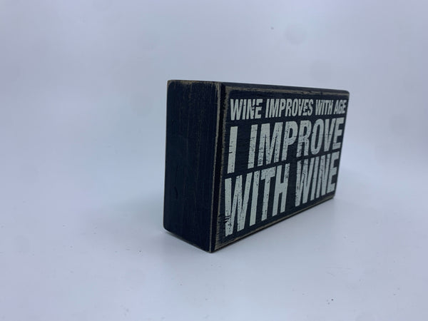 "WINE IMPROVES" BLACK BLOCK SIGN.