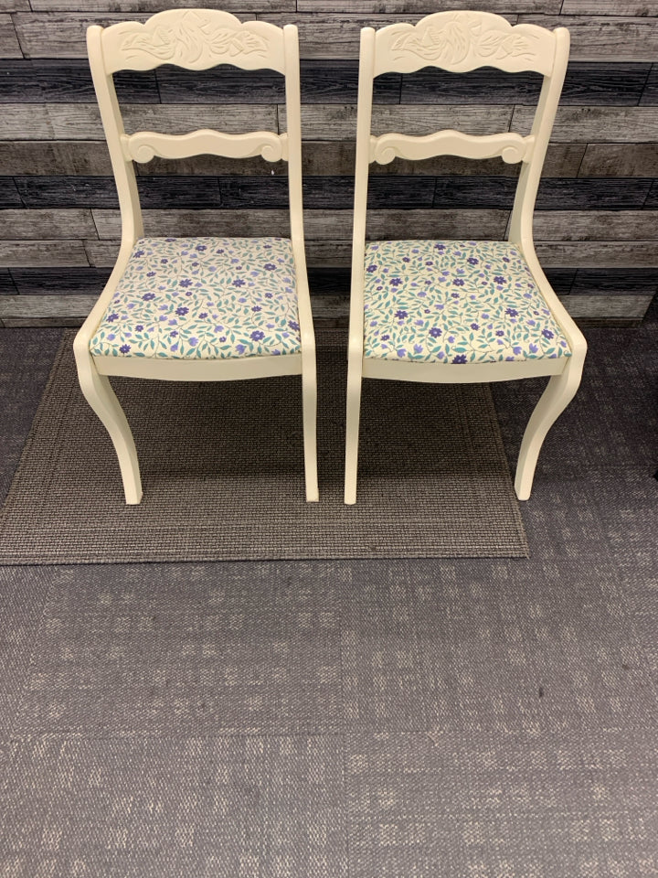 2 CREAM PAINTED SIDE CHAIRS W/BLUE FLORAL FABRIC SEAT.