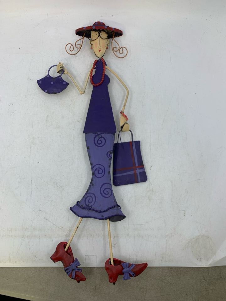 METAL WOMAN IN PURPLE DRESS W/ GLASSES & RED SHOES.