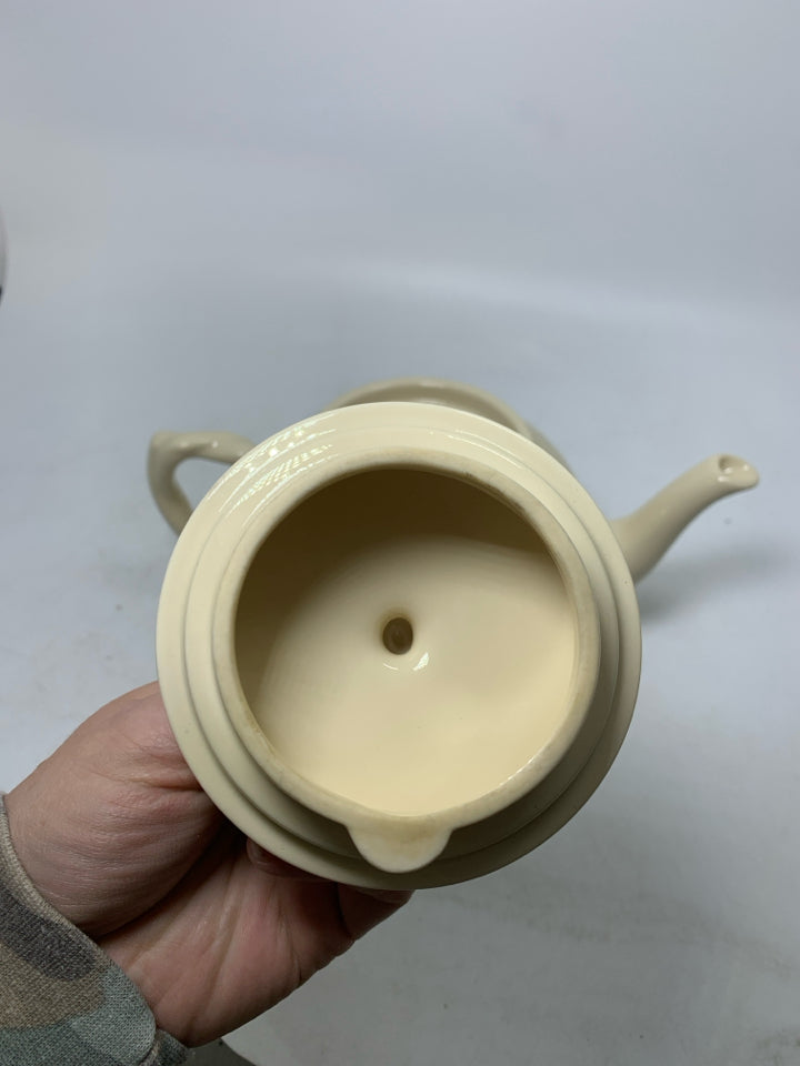 TWISTED HANDLE EMBOSSED LEAVES TEAPOT.