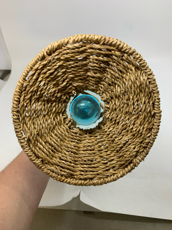 BLUE TINTED GLASS W/ WOVEN BASE CANDLE HOLDER.