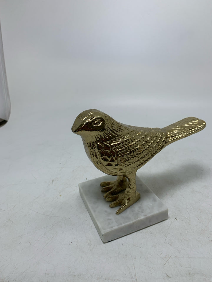MARBLE SLAB W/ GOLD METAL BIRD DECOR.
