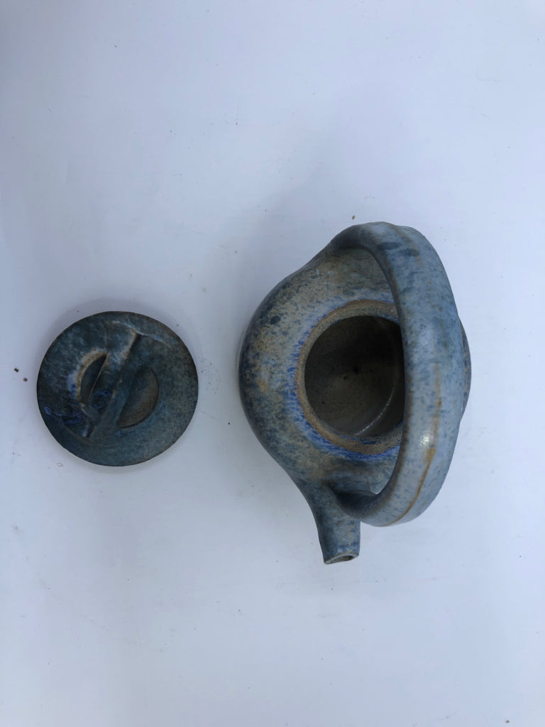 SMALL BLUE HEAVY POTTERY TEA POT W/ TAN DETAILS.