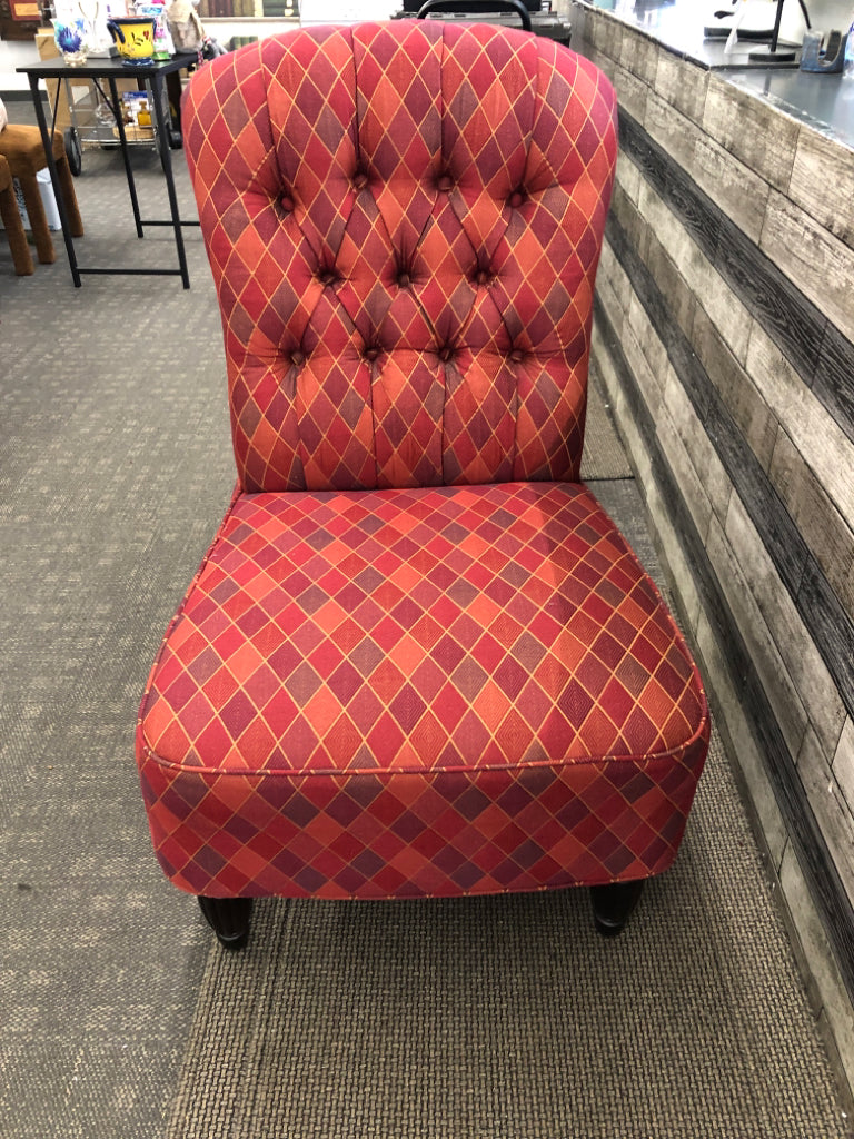 MULTI COLORED PRISM PATTERN FABRIC ACCENT CHAIR.