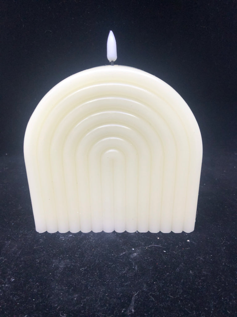 WHITE PLASTIC RAINBOW FAUX CANDLE LIGHT.