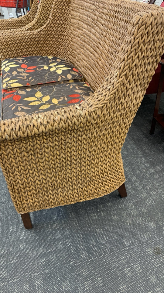 WICKER SOFA W/BROWN CUSHION.