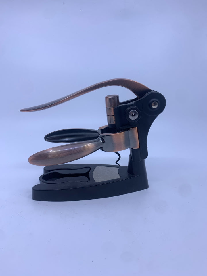 ROSE GOLD WINE OPENER W STAND.