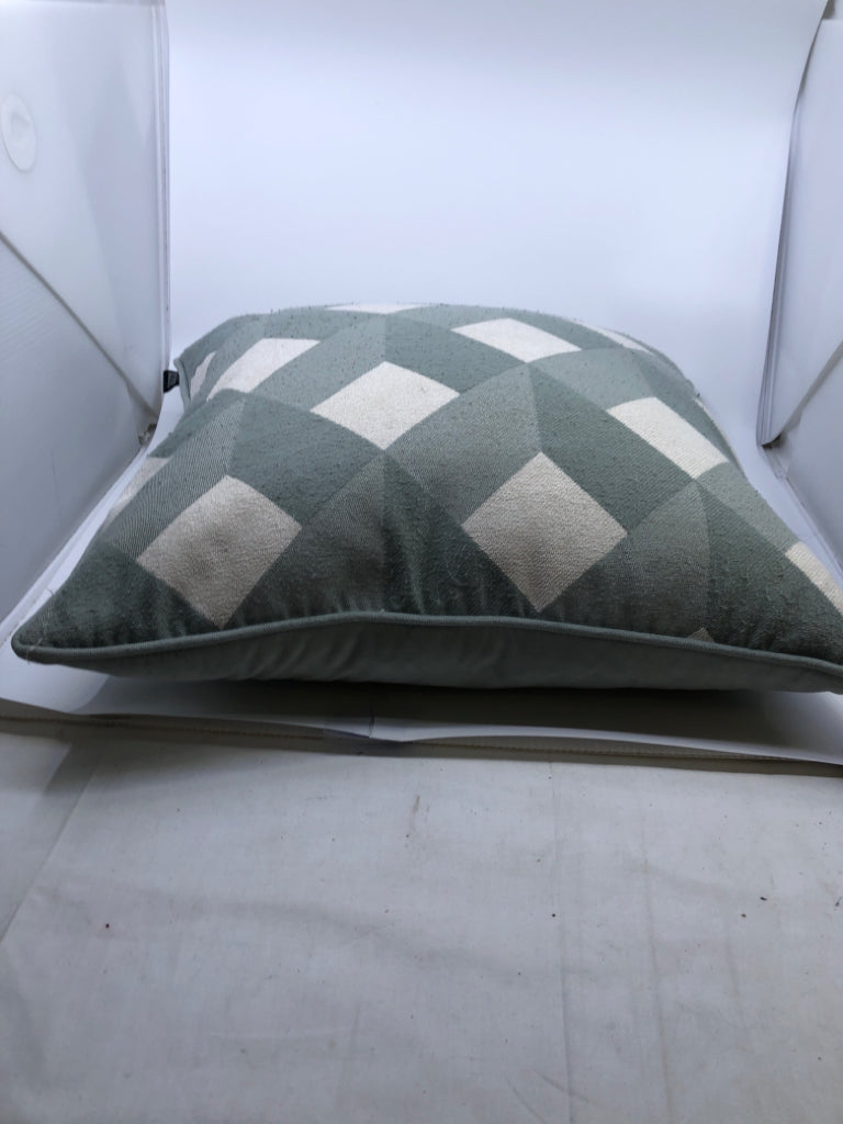 TEAL AND WHITE DIAMOND PATTERN PILLOW.