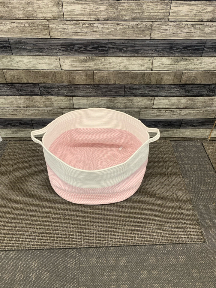 LARGE WOVEN PINK/WHITE BASKET.