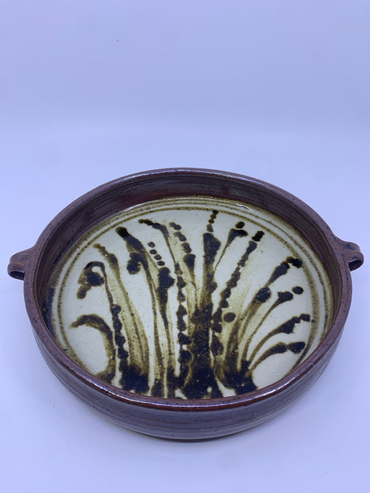 BROWN POTTERY DISH WITH HANDLES.