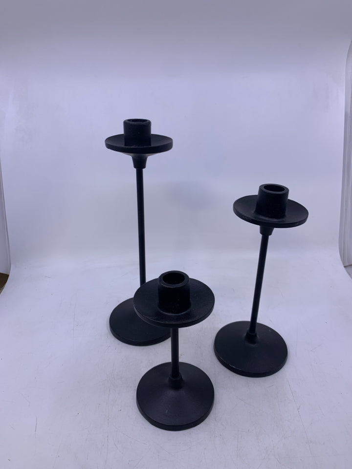 3 BLACK METAL TAPERED CANDLE HOLDERS.