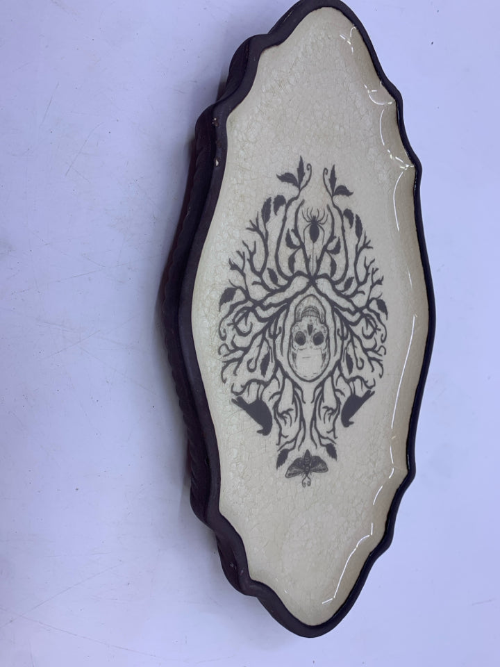 SKELETON AND CROWS GLAZED TOP CERAMIC DISH.