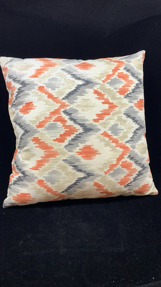 ORANGE ARROW DESIGN PILLOW.