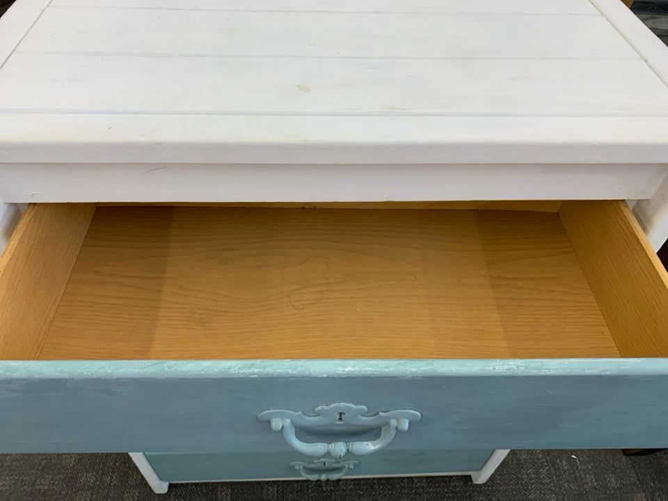 WHITE SHORT DRESSER W 4 TEAL DRAWERS.