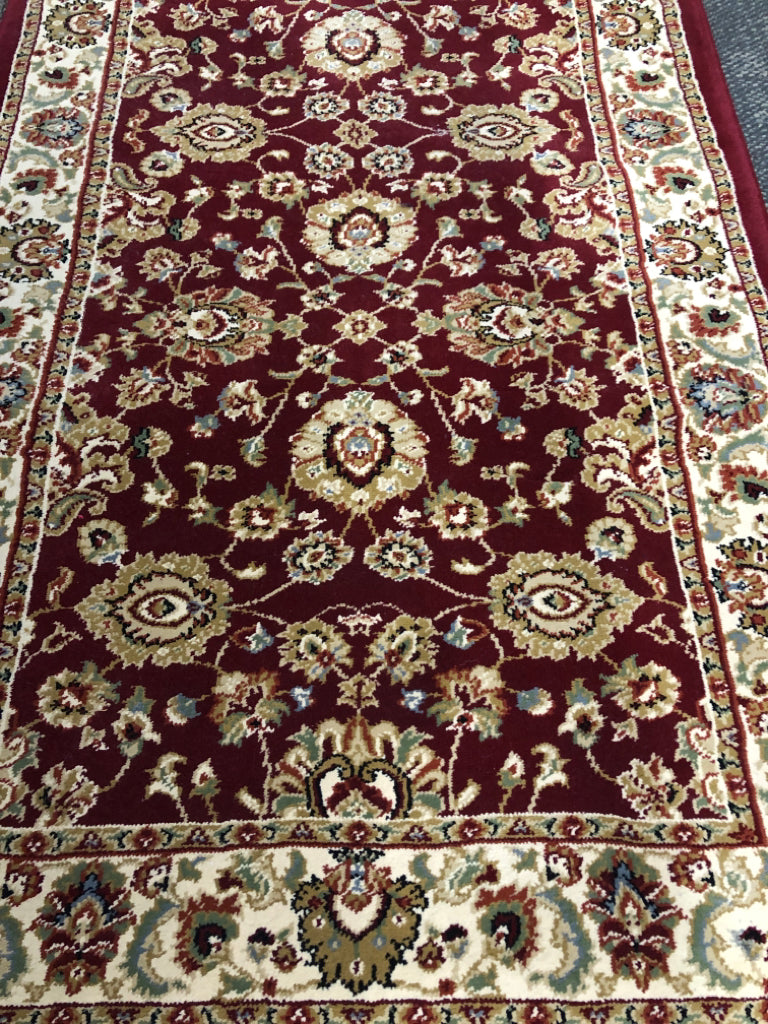 RED AND FLORAL ORIENTAL RUG.