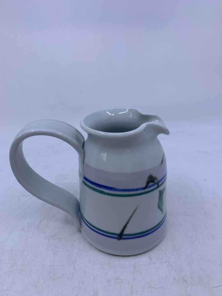 WHITE PITCHER W/ BLUE/GREEN STRIPES LONG HANDLE.