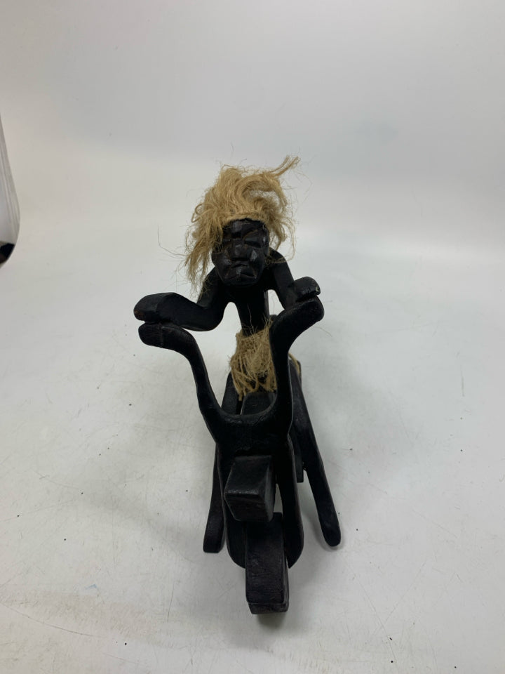 WOOD CARVED FOLK ART MAN ON MOTORCYCLE.