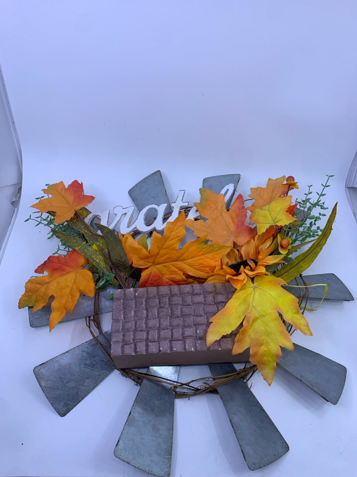 GRATEFUL METAL SUN WREATH W/ ORANGE LEAVES.