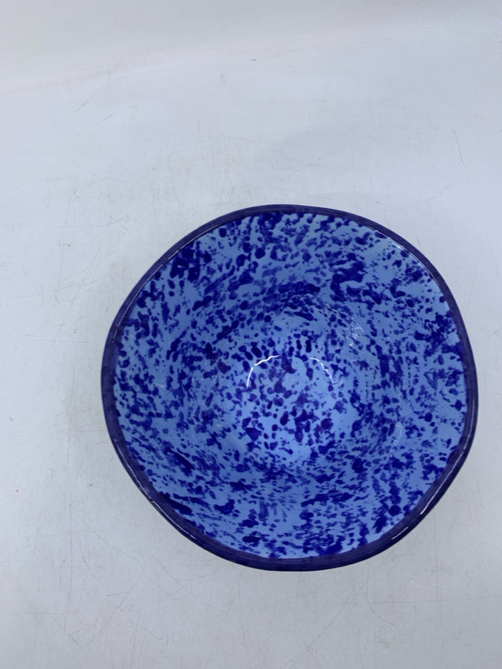 DARK BLUE CERAMIC BOWL W/ BLUE DOTS INSIDE.