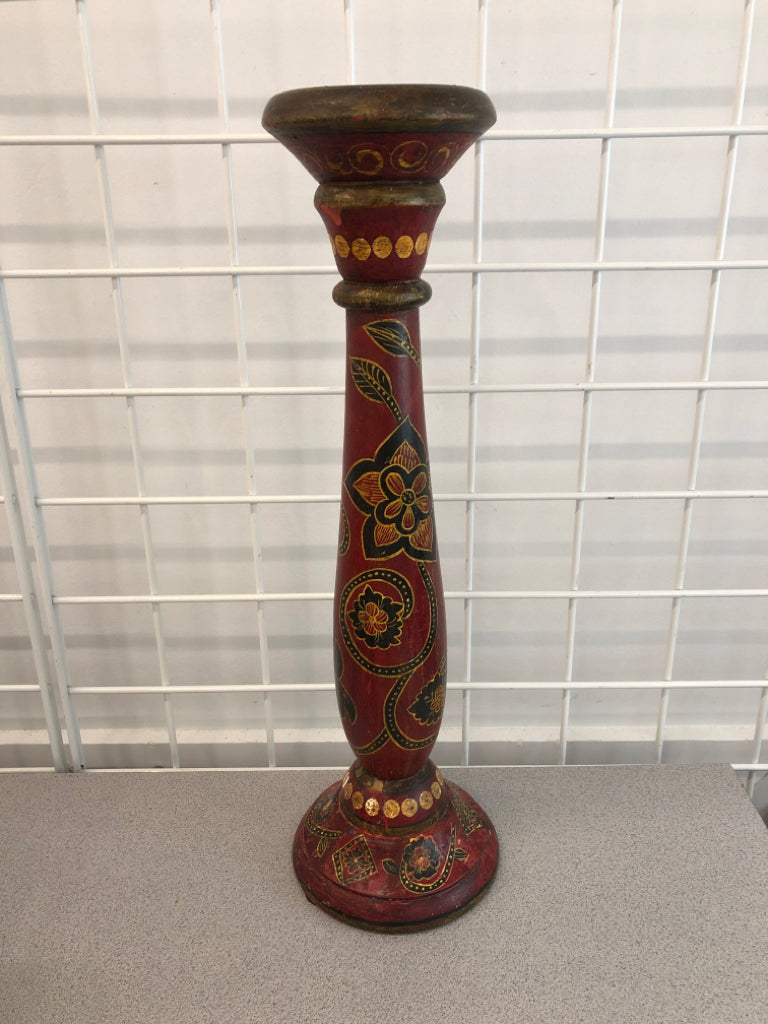 RED WOOD PILLAR CANDLE HOLDER W/BLACK FLOWERS.