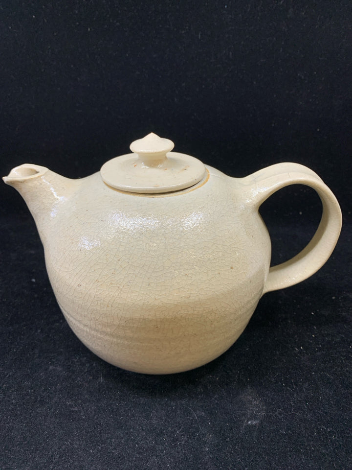 TAN POTTERY TEAPOT.