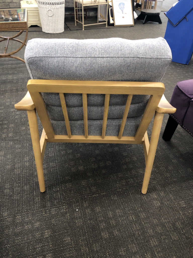 TAN CHAIR W/ GREY CUSHION.