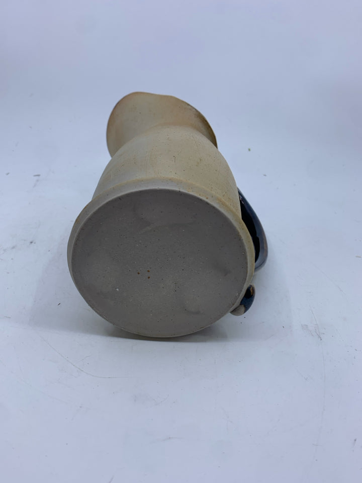 TAN/BROWN CERAMIC PITCHER.