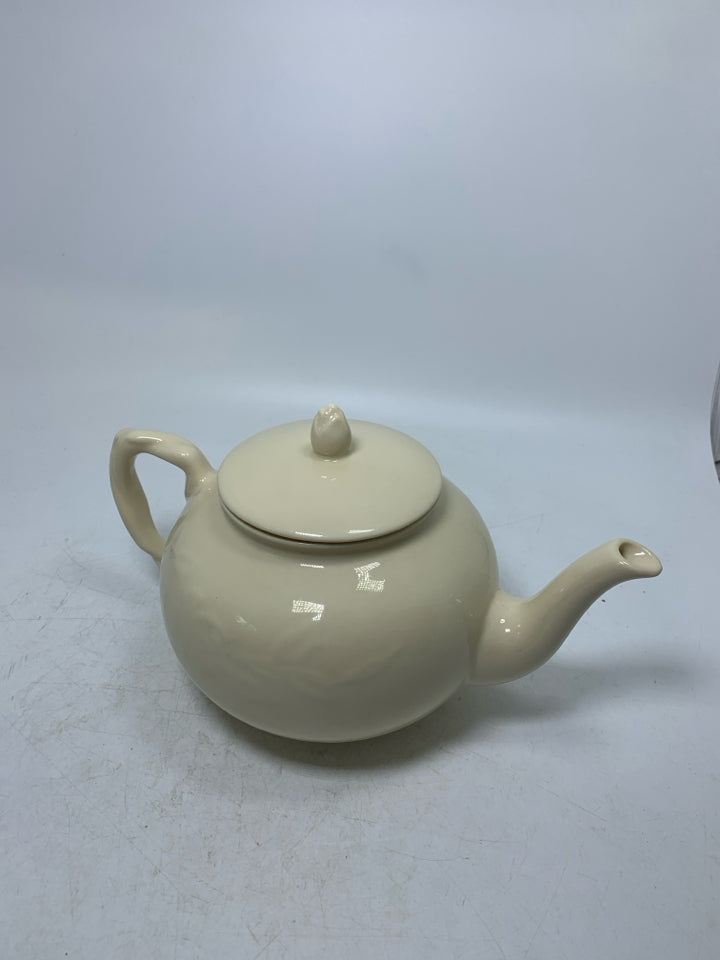 TWISTED HANDLE EMBOSSED LEAVES TEAPOT.
