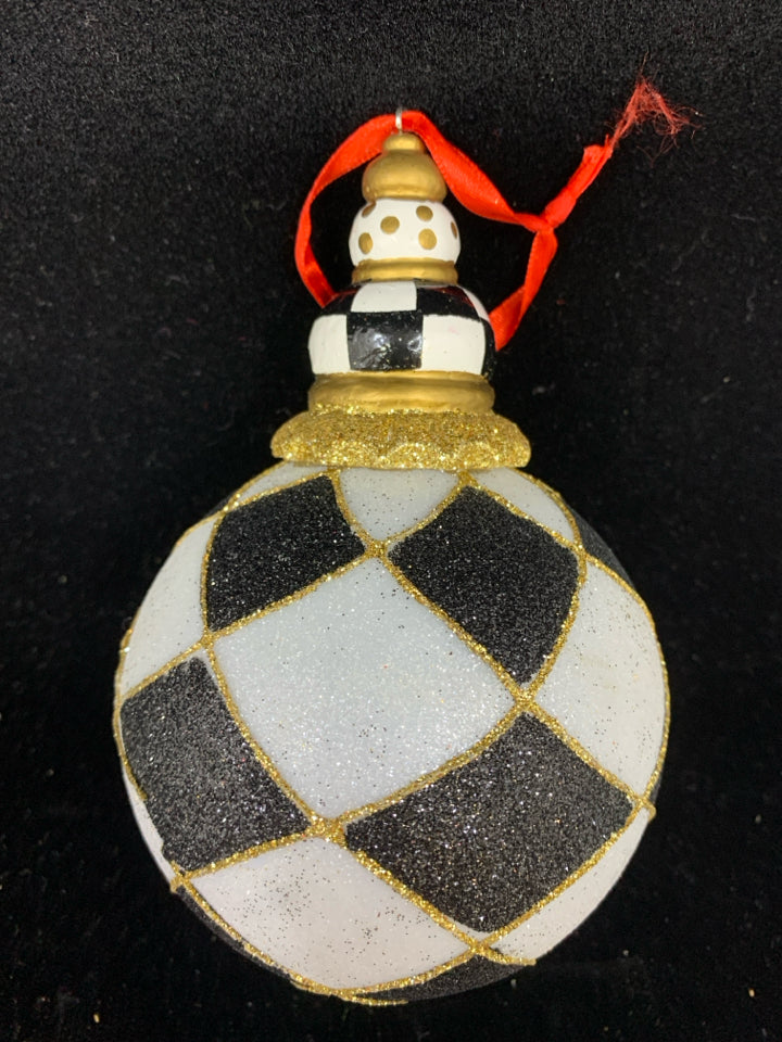 4 BLACK/WHITE CHECKERED GLASS ORNAMENTS.