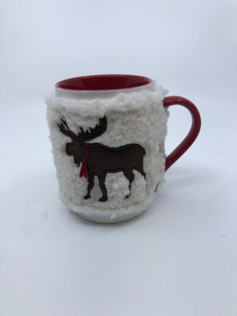 WHITE AND RED MUG W REINDEER SWEATER.