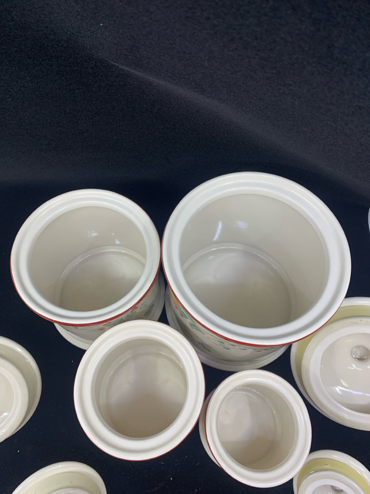 4 PC CANISTER SET CREAM W/ ASSORTED FRUITS/ RED RIM.