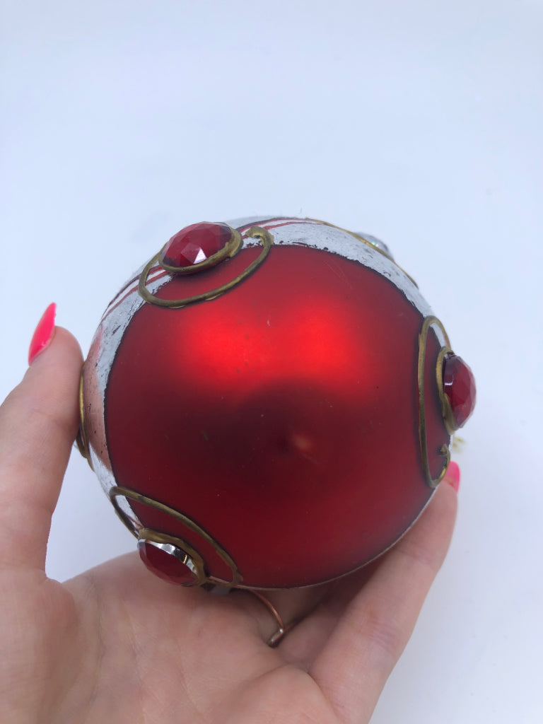 RED W/ SILVER BAND GLASS ORNAMENT W/ EMBOSSED JEWELS.