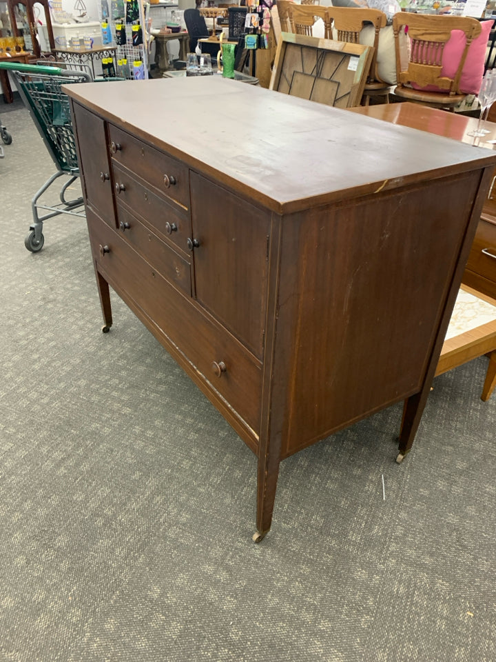 VTG DARK WOOD BUFFET 4 DRAWERS, 2 DOORS ON WHEELS.
