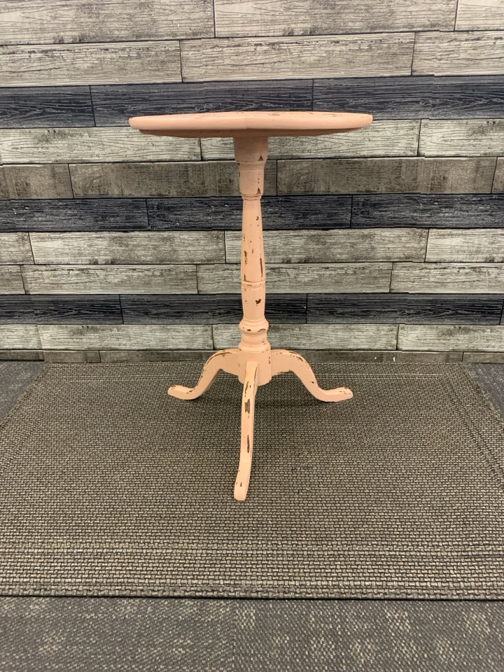 DISTRESSED PEACH AND WOOD ROUND SIDE TABLE.