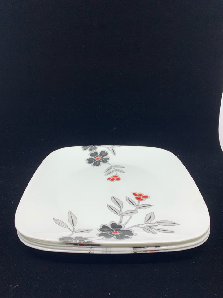 4 CORELLE DINNER PLATES W/RED AND BLACK FLORAL.