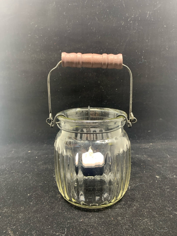 GLASS JAR W BLACK TEA LIGHT HOLDER ACCENT AND HANDLE.