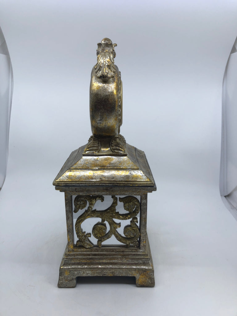 DISTRESSED RESIN GOLD FOOTED STORAGE BOX W/ CLOCK ON COVER.