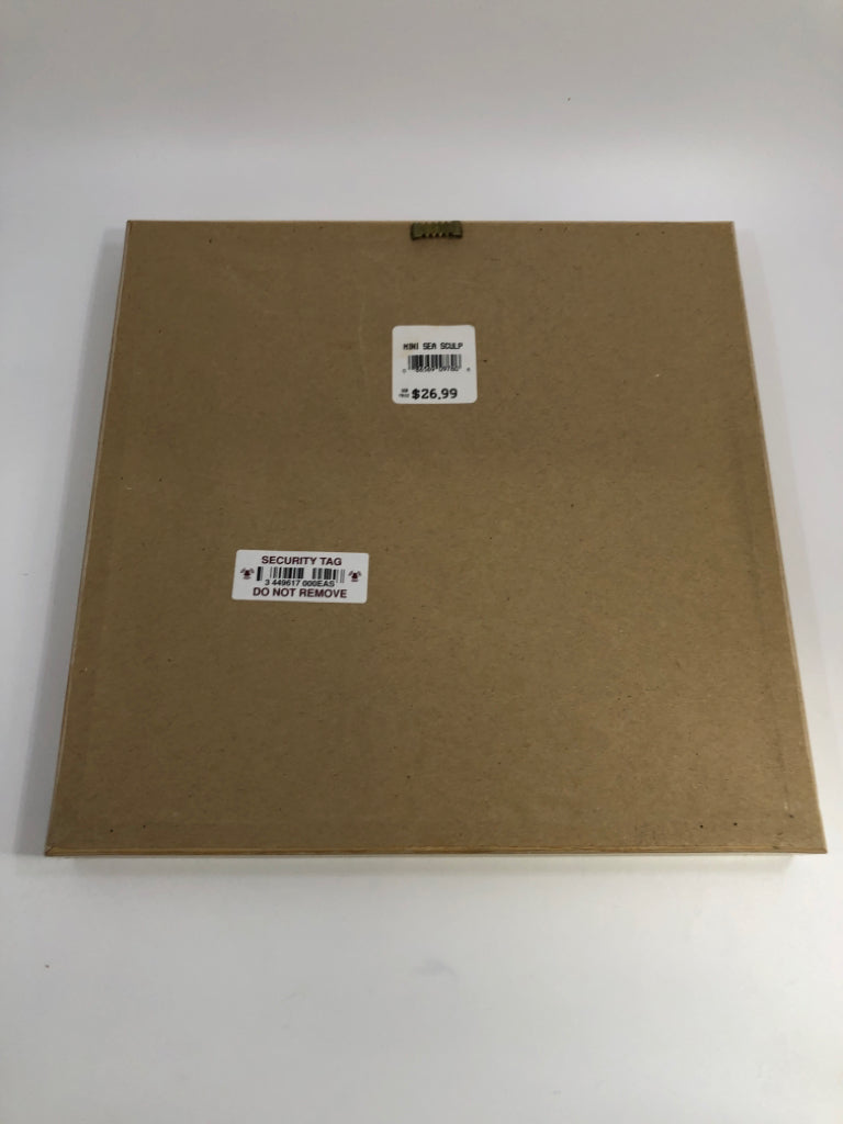 SEASHELL COLLAGE IN SHADOW BOX W/TAN&PINK WOODEN FRAME.